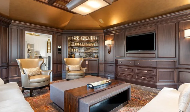 Wood-paneled sitting room with a built-in bar — Deep River, CT residence