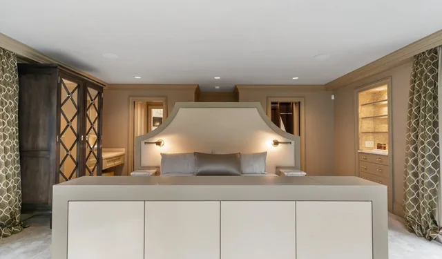 Bedroom with an upholstered headboard and built-in storage — Deep River, CT residence
