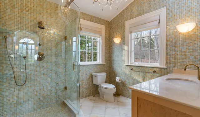 Mosaic-tiled bathroom with a glass shower — Deep River, CT residence