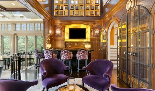 Wood-paneled bar with purple lounge chairs — Deep River, CT residence