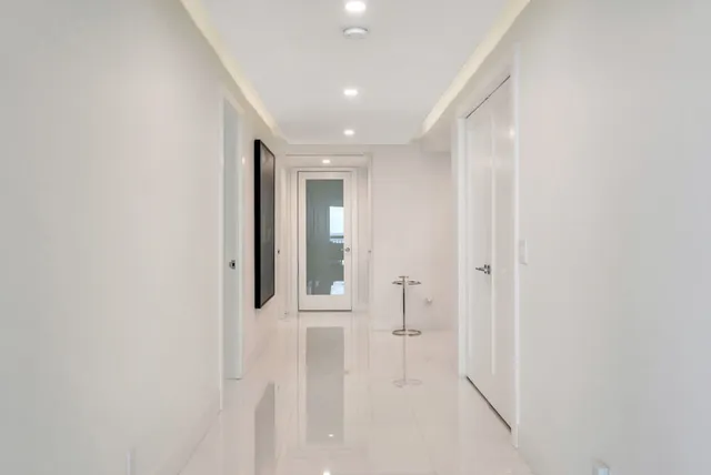 White and gray cabinetry with high-gloss finishes — Palm Beach, FL residence